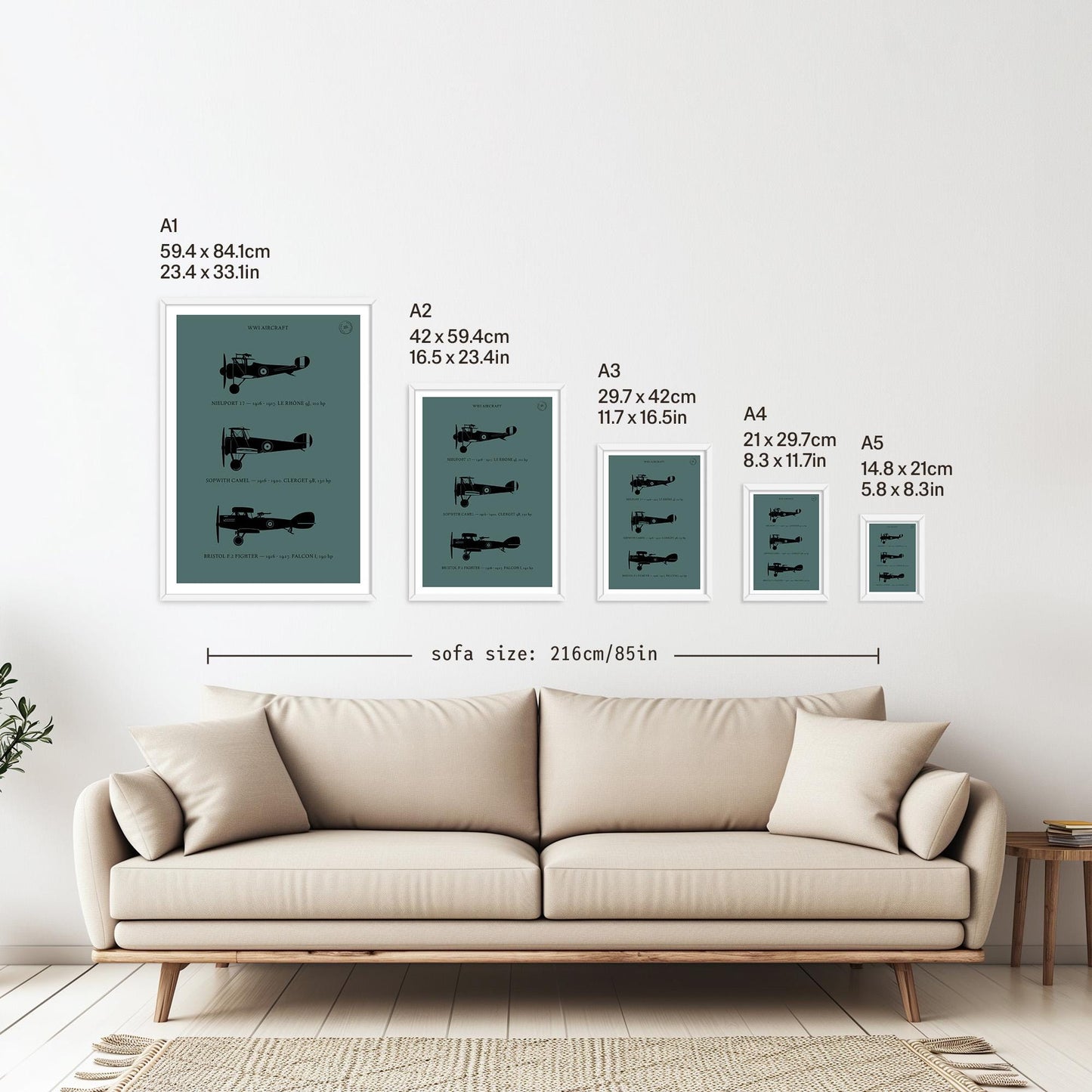 5 framed posters hanging on a white wall above a sofa. They are arranged according to size from A1 down to A5 with the correspondent measurements listed in inches and centimetres next to each