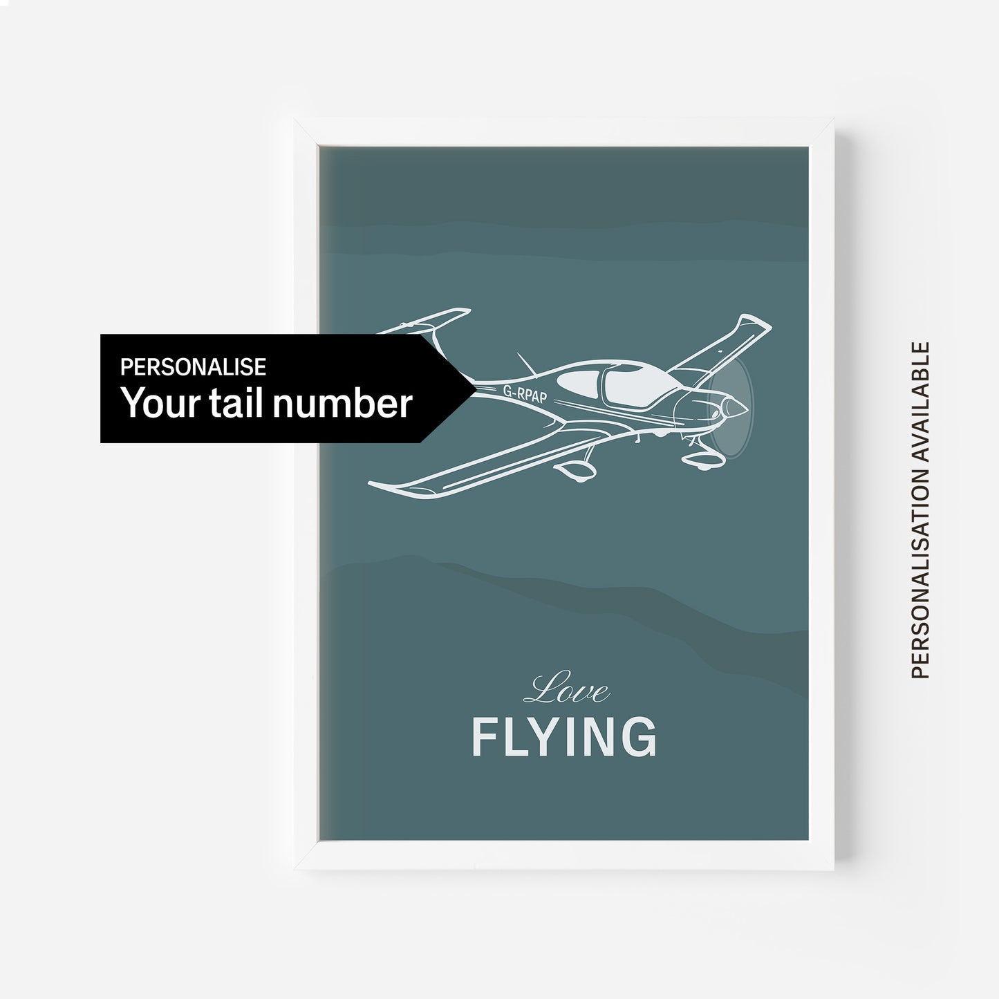 A poster on a white frame showing a light aircraft illustration with the words Love Flying in white over a teal background. On the of the image a black arrow points to the aircraft tail number with the words personalise your tail number 