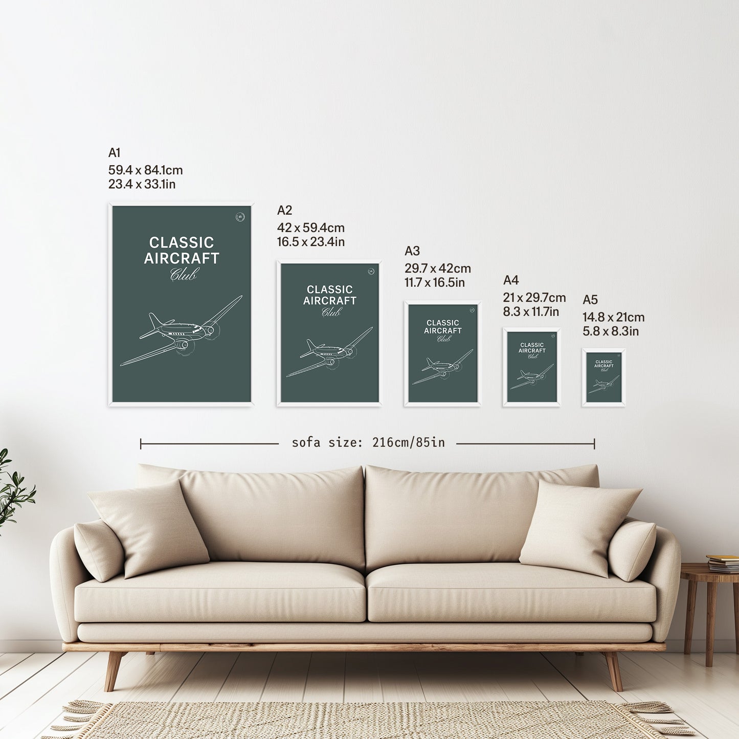 5 framed posters hanging on a white wall above a sofa. They are arranged according to size from A1 down to A5 with the correspondent measurements listed in inches and centimetres next to each