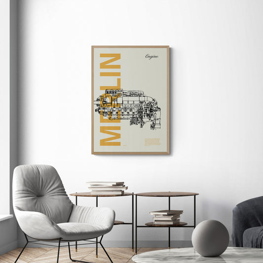 A framed poster hanging on the living room over a chair and two tables. It shows a Merlin aircraft engine in line drawing style with the word Merlin written big in mustard yellow