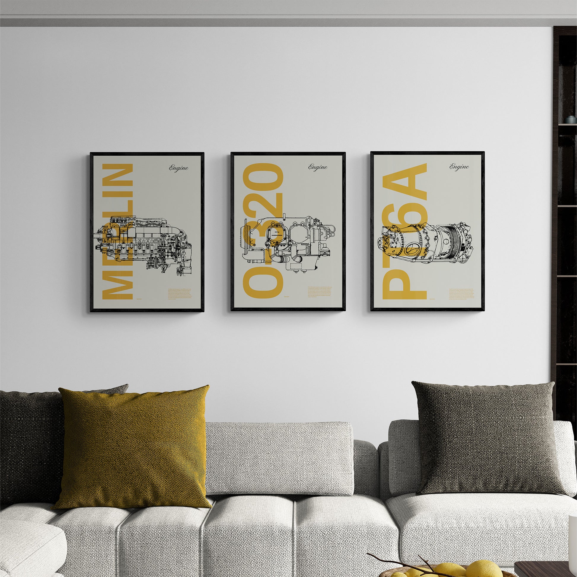 Three framed posters hanging in a modern living room over a sofa with cushions. Each shows a famous aircraft engines in line drawing style, with the engine name written big in mustard yellow