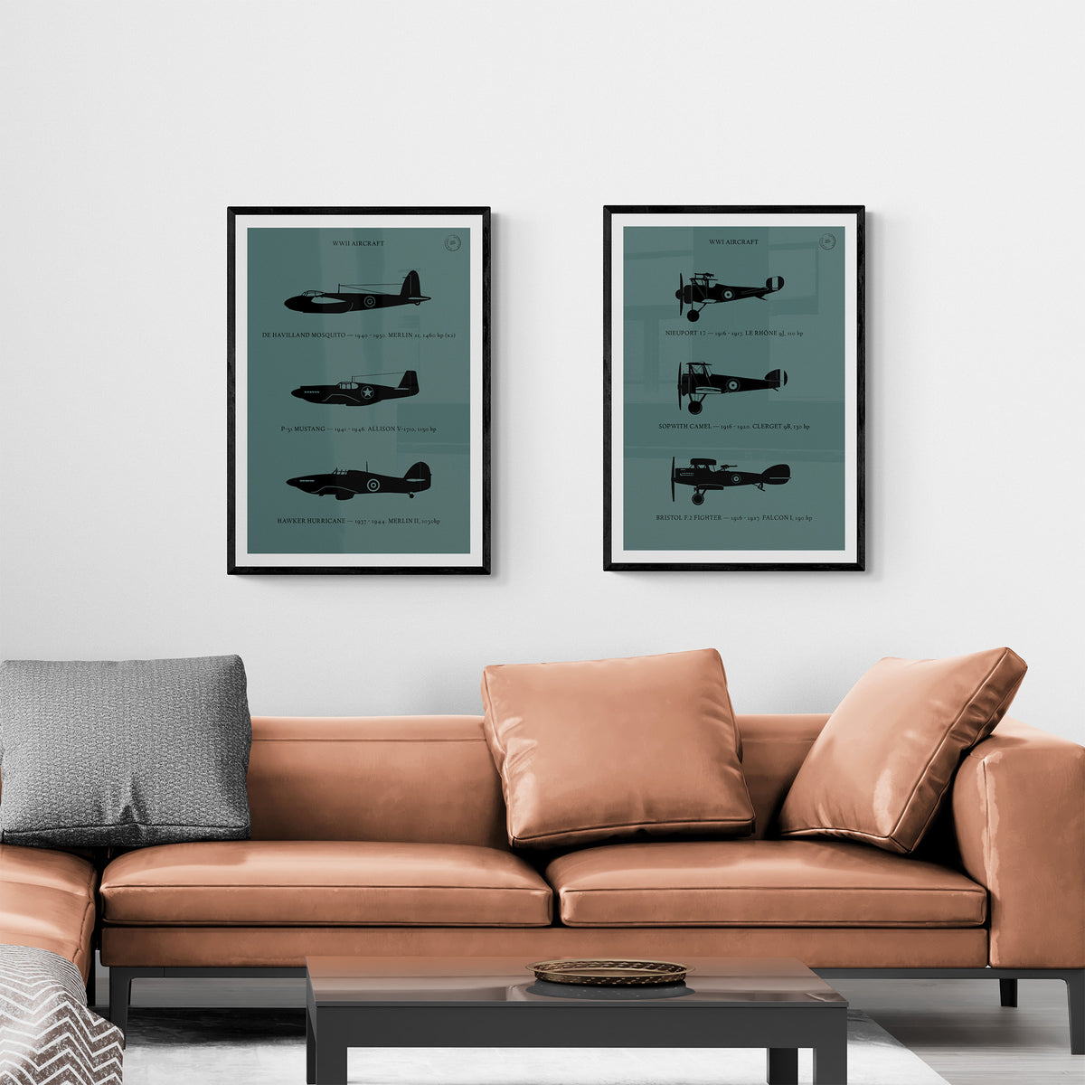 Two framed prints hanging over a leather sofa in a modern living room. The first shows three World War One aircraft in silhouette style and the second shows three World War Two aircraft in silhouette style. Both in black over a dark grey background