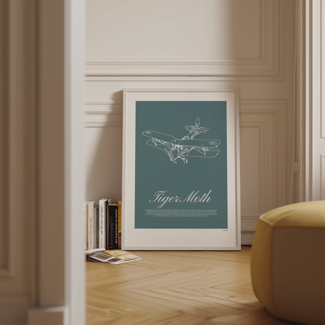 Framed poster displayed in variety of scenes. The poster shows a light aircraft illustration with the words Tiger Moth in white over a teal background