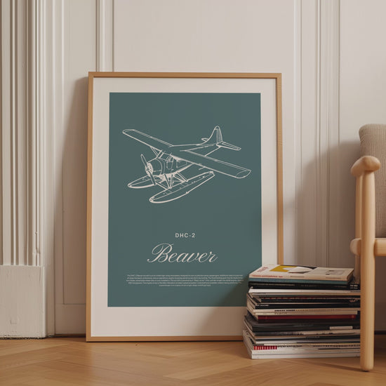 Framed poster displayed in variety of scenes. The poster shows a light aircraft illustration with the words DHC-2 Beaver in white over a teal background
