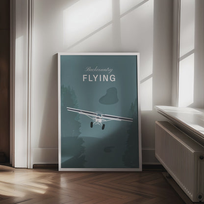 Framed poster displayed in variety of scenes. The poster shows a white illustration of a light aircraft with trees around it and a a teal coloured background and the words backcountry flying